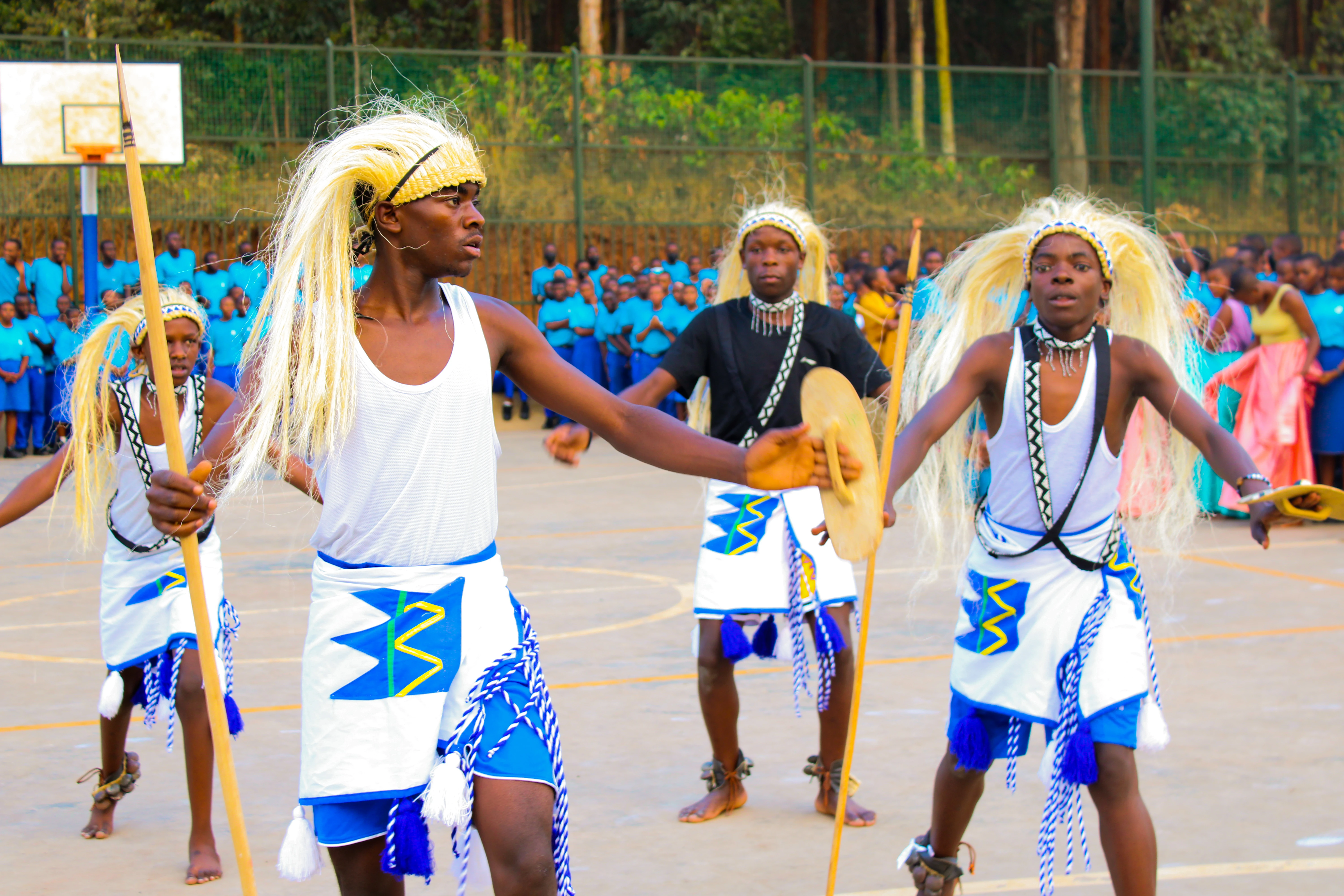 Students in traditional dance attire performing